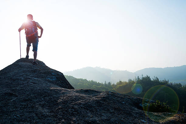 istock Male hiker standing on a rock 541001956