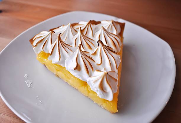 istock Lemon Tarts in plate white on wooden table. 541003010