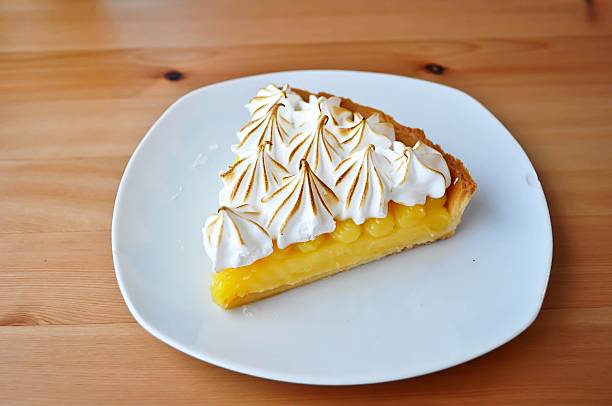 istock Lemon Tarts in plate white on wooden table. 541003096