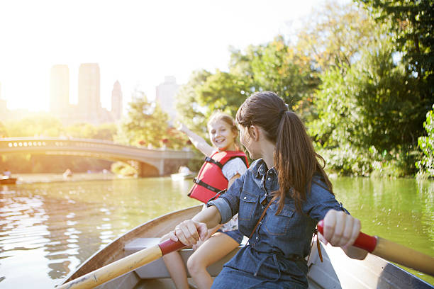 istock Mother and daughter rowing boat 541004098