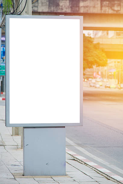 istock blank billboard on road with city view background 541004796