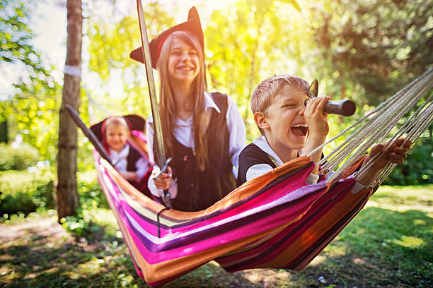 Kids playing pirates on hammock boat
