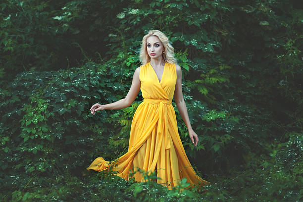 istock Charming woman in yellow dress. 541006502