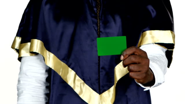 Student approves a green card. White. Close up