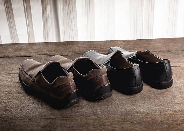 istock men's shoes on wooden background 541109322