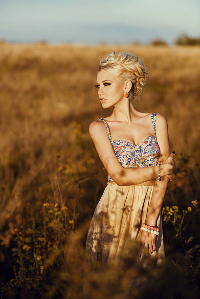 istock Young beautiful girl in the field 541112362