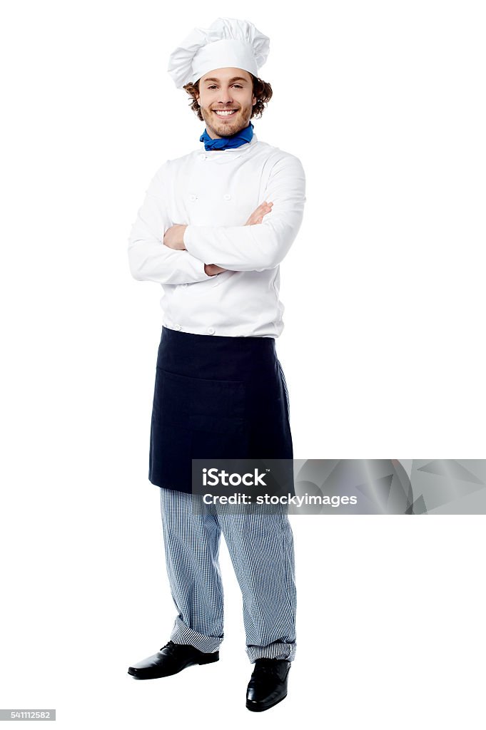 I am the executive chef here. Confident happy male chef posing to camera Full Length Stock Photo