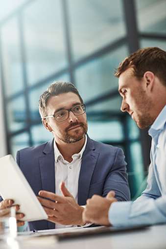 Cropped shot of two businessmen meeting in the office