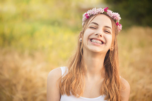 Beautiful girl on the field in sun light. stock photo