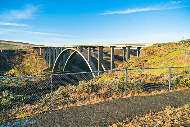 istock arc concrete bridge a cross the river when sunset. 541116604