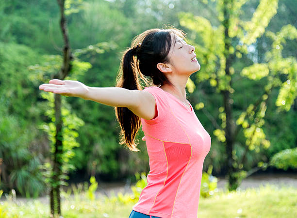 istock Asian woman enjoying fresh air 541116686