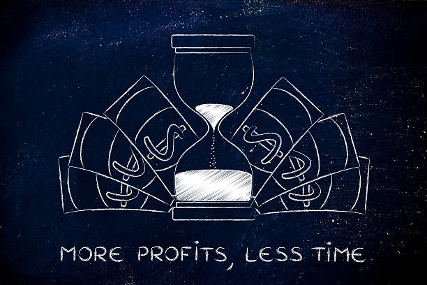 more profits in less time: hourglass with cash stock photo