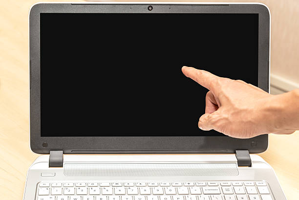istock Businessman pointing finger on black laptop screen over office b 541119500