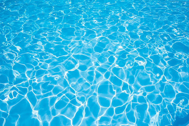istock Beautiful water surface in swimming pool with sun reflection 541119514