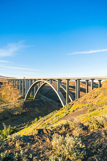 istock arc concrete bridge a cross the river when sunset. 541120720