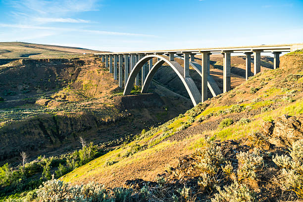 istock arc concrete bridge a cross the river when sunset. 541120762