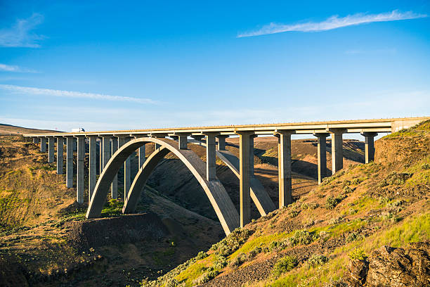 istock arc concrete bridge a cross the river when sunset. 541120874