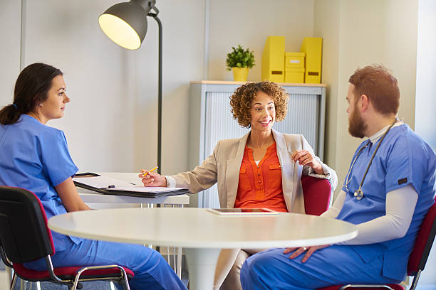 istock medical staff meeting with administrator 541123458