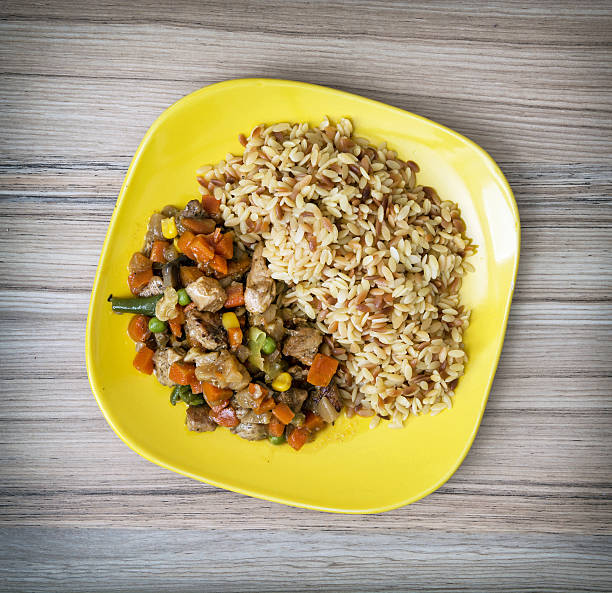 istock Chicken meat with fried rice and steamed vegetables 541124546