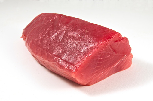 Tuna fillet, white background.