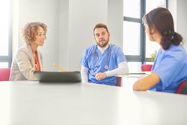 istock medical administrator with staff 541126204