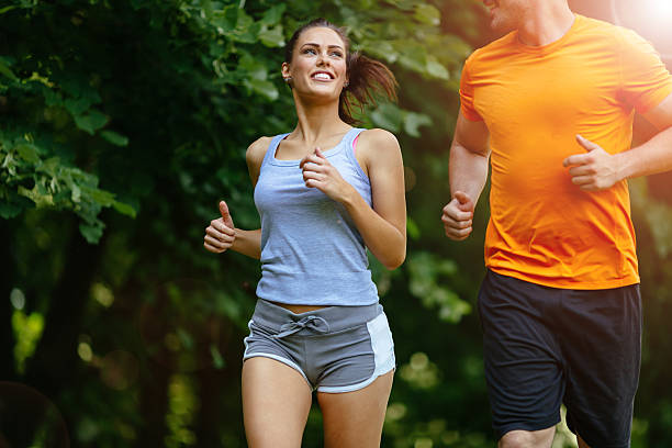 istock Beautiful couple jogging in nature 541126234