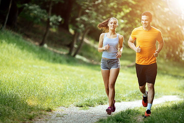 istock Beautiful couple jogging in nature 541126310