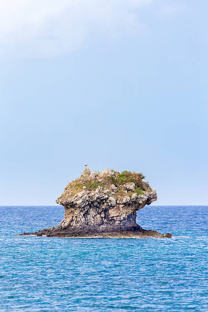 istock One outstanding rock rising from sea level 541126432