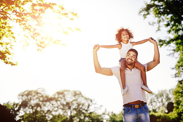 istock Father carrying daughter piggyback 541127976