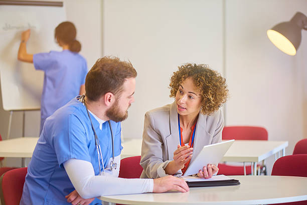 istock consultant with male nurse 541128984