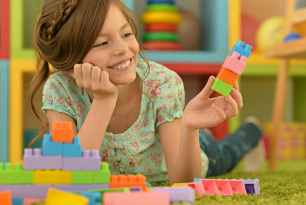istock little girl playing with toys 541129098