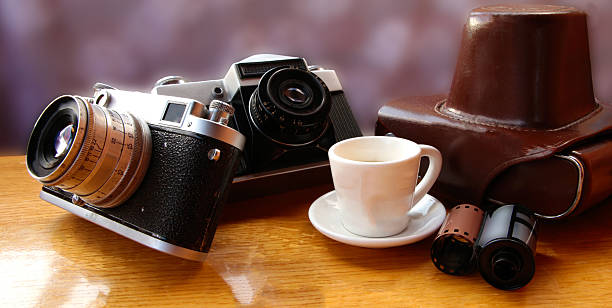 istock Vintage camera on wooden table 541130262