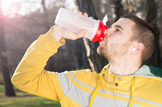 istock Replenishing his body after a hard run 541132088