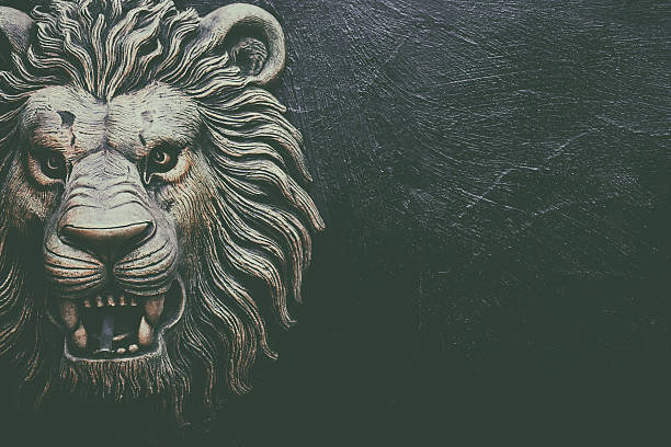 istock Black and white lion head statue 541132584