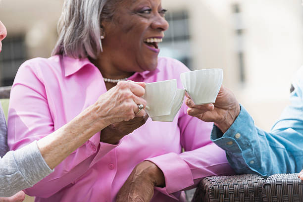 istock Group of multi-ethnic seniors toasting with coffee cups 541133252
