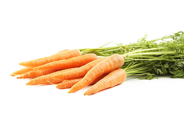 istock Fresh carrots isolated on a white 541134092