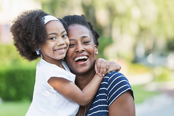 istock Mother with beautiful mixed race young daughter 541134502