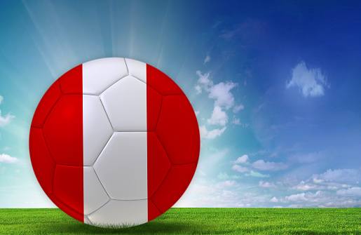 Soccer ball in nature with Peuvian flag