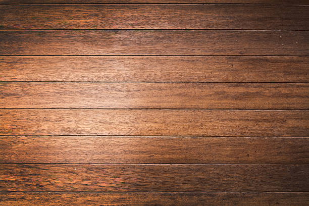istock Brown wood planks background texture closeup. 541136932