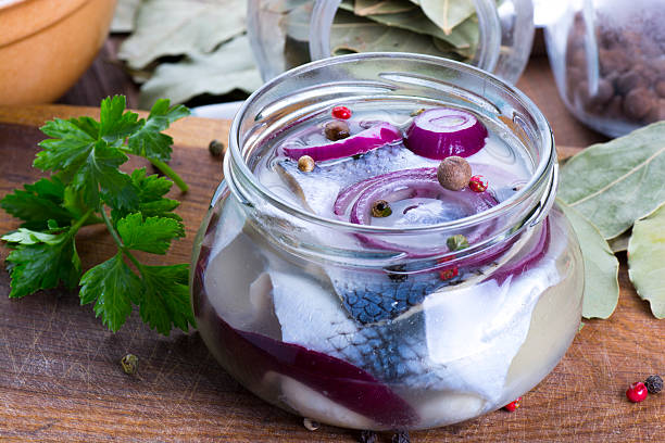 Marinated herring in a jar stock photo