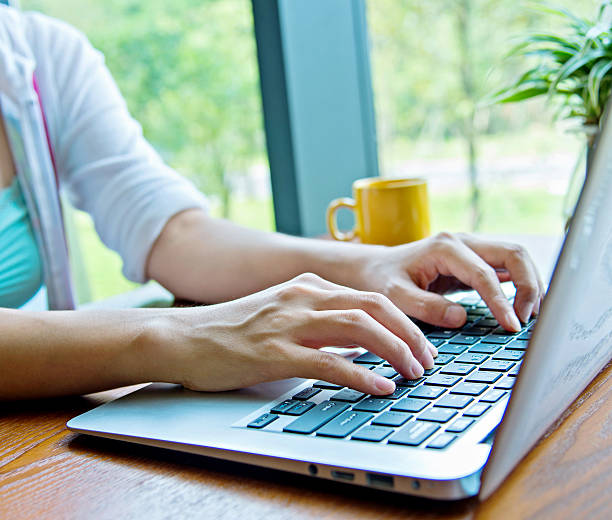 istock Woman hand typing on laptop 541144450