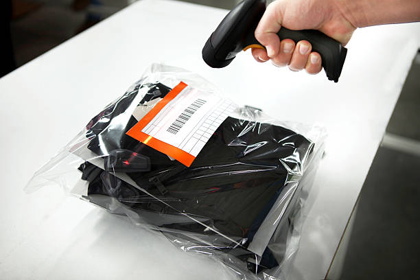 istock Worker Scanning Package In a textile factory 541146090