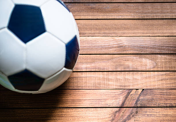 istock soccer ball on a plank wood 541146162
