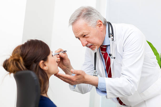 istock Doctor visiting a patient's eyes 541146250
