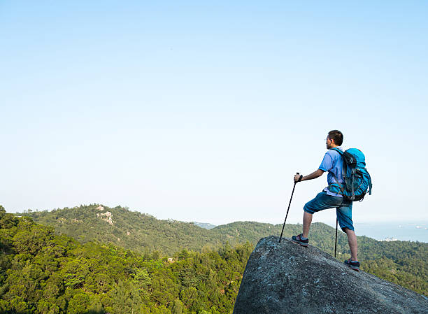 istock Hiking man on a rock 541146418