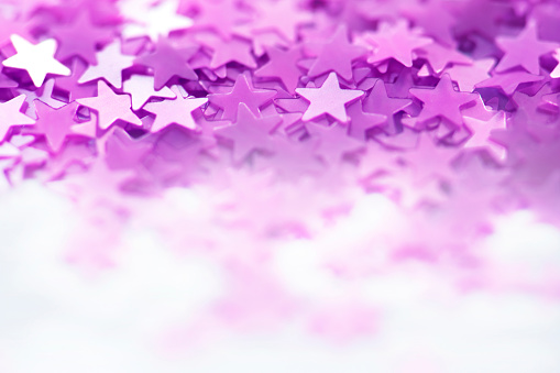 purple star with defocused lights background.