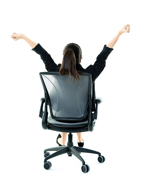 geschäftsfrau arme hoch - office chair cheering ecstatic success stock-fotos und bilder
