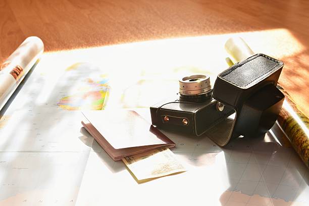 Beautiful concept for summer travel. Map with sunset and accessories for vacation planning.