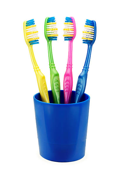 istock colorful toothbrushes in blue cup 541148580
