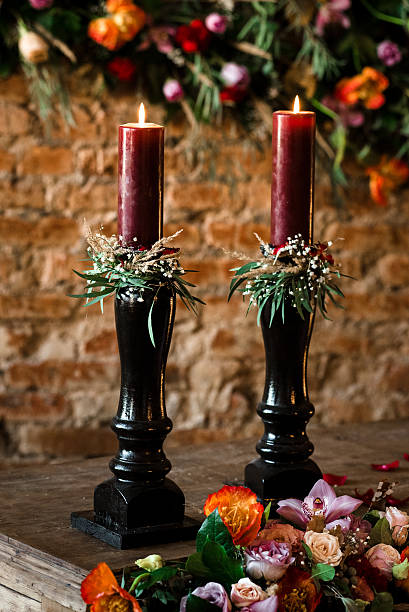 istock Two red candles on a wooden table 541149874